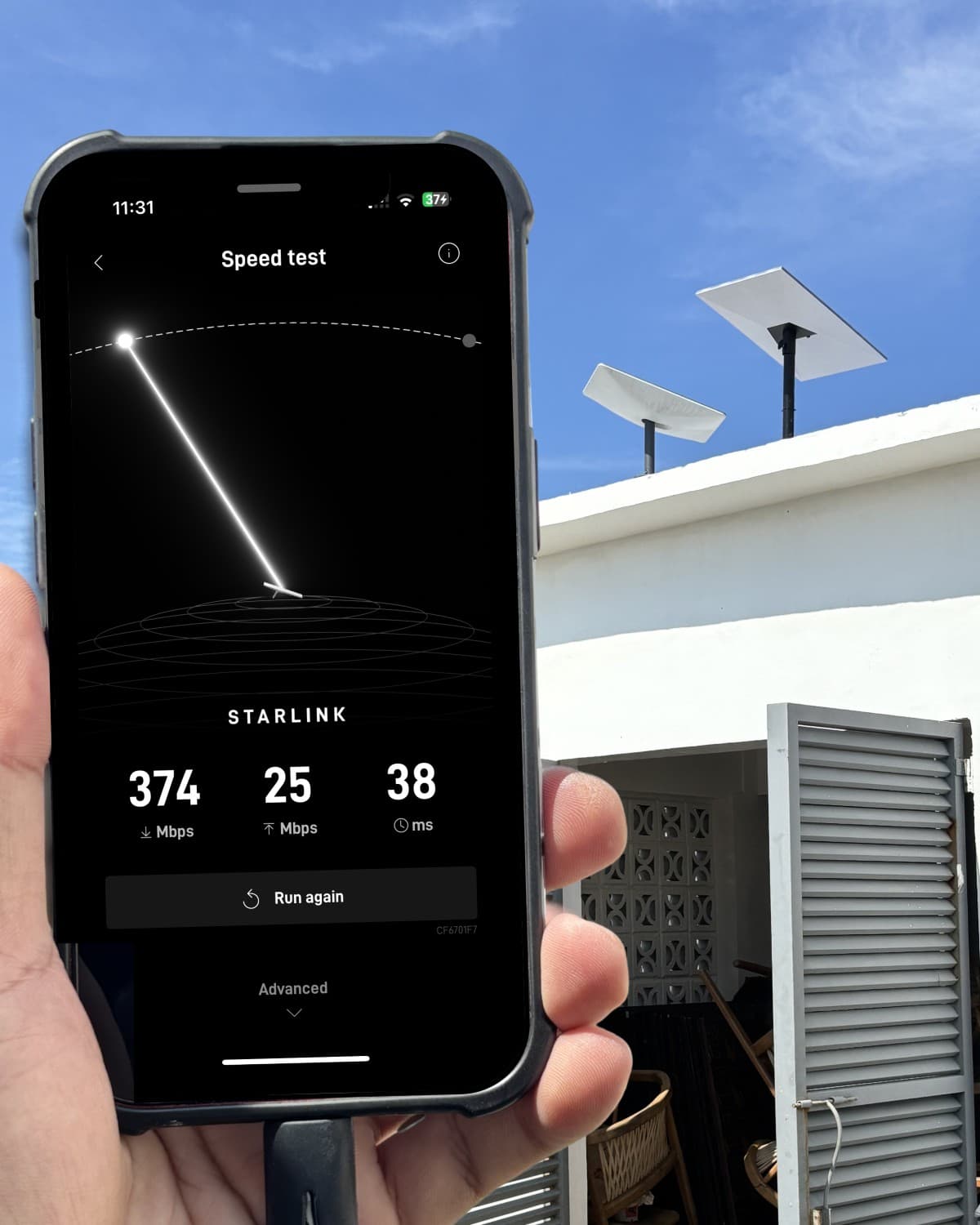 Starlink speed test showing 374 Mbps next to rooftop Starlink dishes on a TechCare business internet install